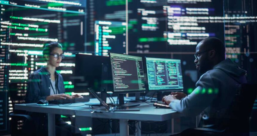 Portrait of Two Diverse Developers Working on Computers, Typing Lines of Code that Appear on Big Screens Surrounding Them. Male and Female Programmers Creating Innovative Software, Fixing Bugs.
