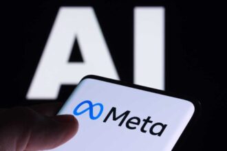 Meta logo seen on smartphone and AI letters on the background. Concept for Meta Facebook Artificial Intelligence. Stafford, UK, May 2, 2023