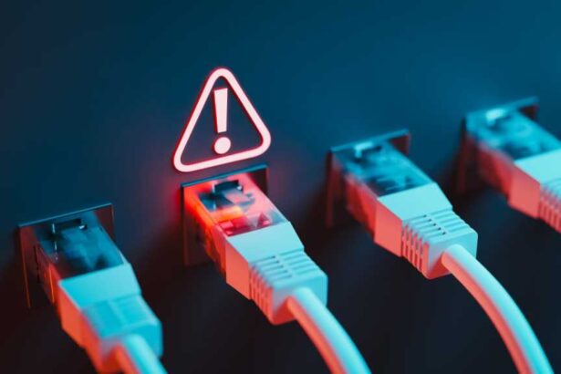 A photograph of a row of Ethernet cables plugged into ports, with a warning sign illuminated above one of the ports.