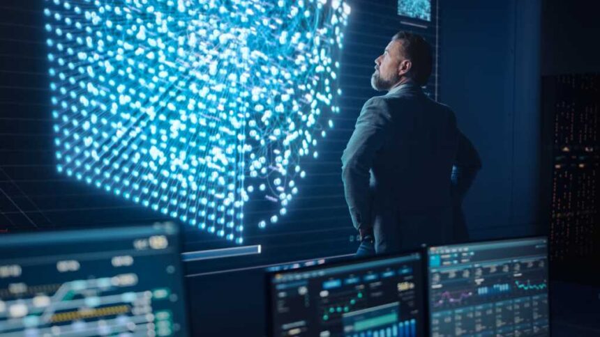 Middle Aged Bearded Senior Project Manager Stands Next to Big Screen with Neural Network. Professional Computer Data Science Engineer Work in a System Control and Monitoring Telecommunications Office