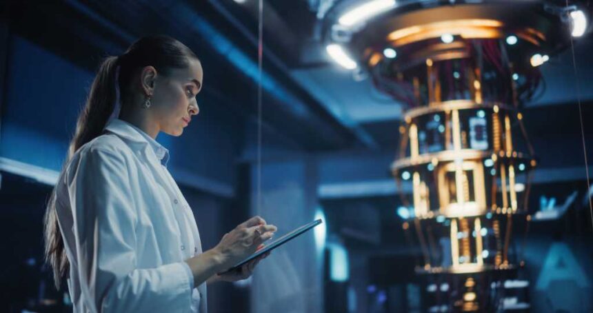 Female Engineer Working on Quantum Computer Hardware, Using Tablet Computer to Access Technical Specifications and Control Processor Parameters. Group of Developers Work on AI Behind a Desk